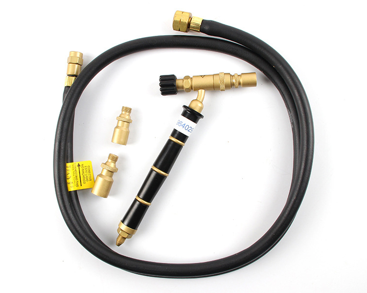 The complete ORCA M75 CMF torch kit laid out, including the torch, three nozzles, and a gas hose