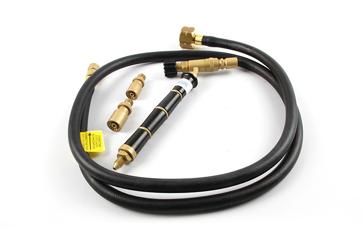 The entire ORCA M75CMG kit arranged together, including the torch handle, two spare nozzles, and the gas hose