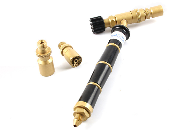 This image shows the main body of the ORCA M75 CMF torch and its three interchangeable nozzles