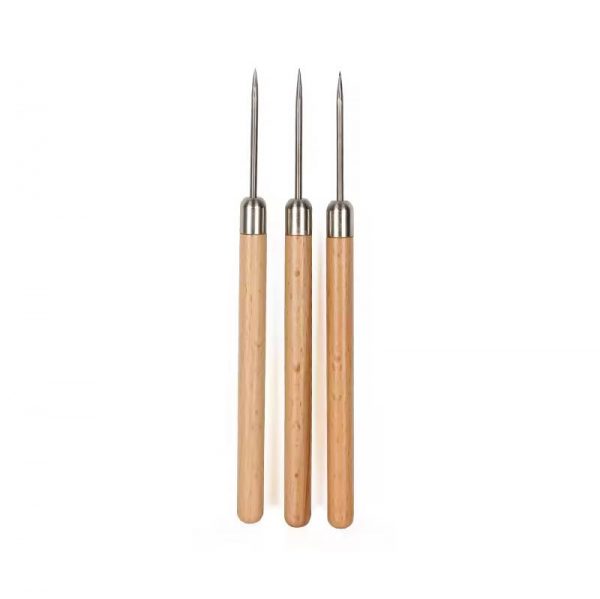 Three Stuccler titanium solder picks with wooden handles, laid out vertically for jewelry making