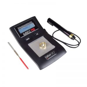 A GEMORO AuRACLE PRO digital gold and platinum tester with its probe and gold file on a white background.