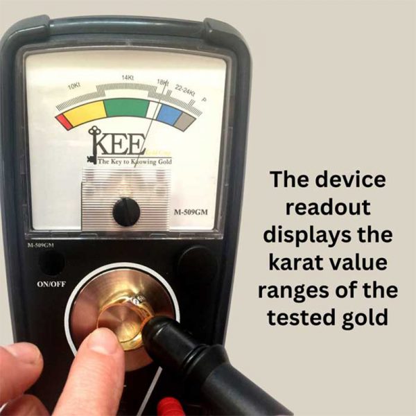 A close-up of the KEE tester's analog meter showing the needle pointing to the 18K to 24K karat range.