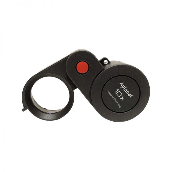 A close-up view of the folded Eschenbach 10x magnifier, highlighting the brand name and magnification.
