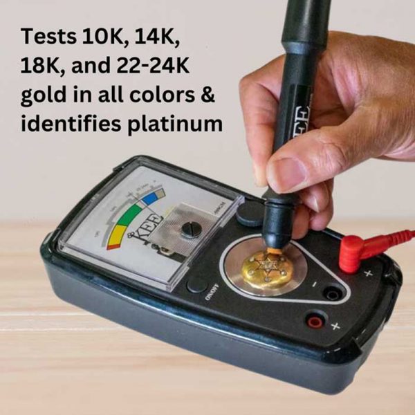 A hand using the KEE tester's pen probe to test a gold piece on the device's testing plate.