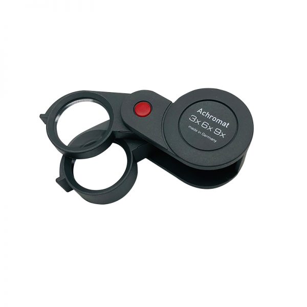 The Eschenbach 1186-9 dual-power magnifier in a compact, folded position to protect the lenses.