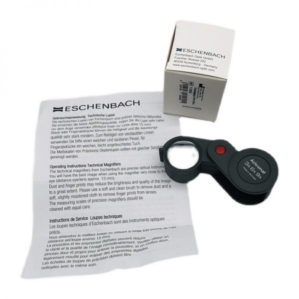 The Eschenbach 1186-9 magnifier with its product box and operating instructions in multiple languages.