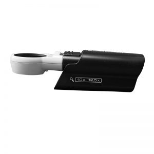 The Eschenbach Mobilux LED magnifier is shown in a compact storage position, partially inside the protective case