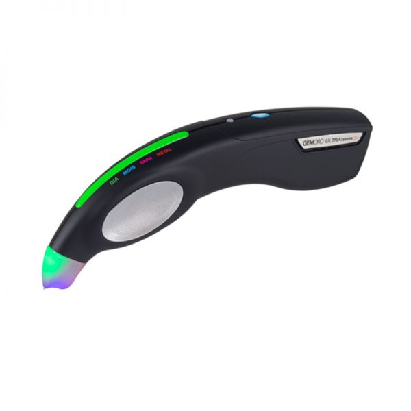 The GemOro UltraTester 3+ handheld jewelry tester, showing a green light for a diamond test.