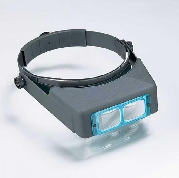 The Original Optivisor Head Magnifier on a white background at an angle with a reflection underneath.